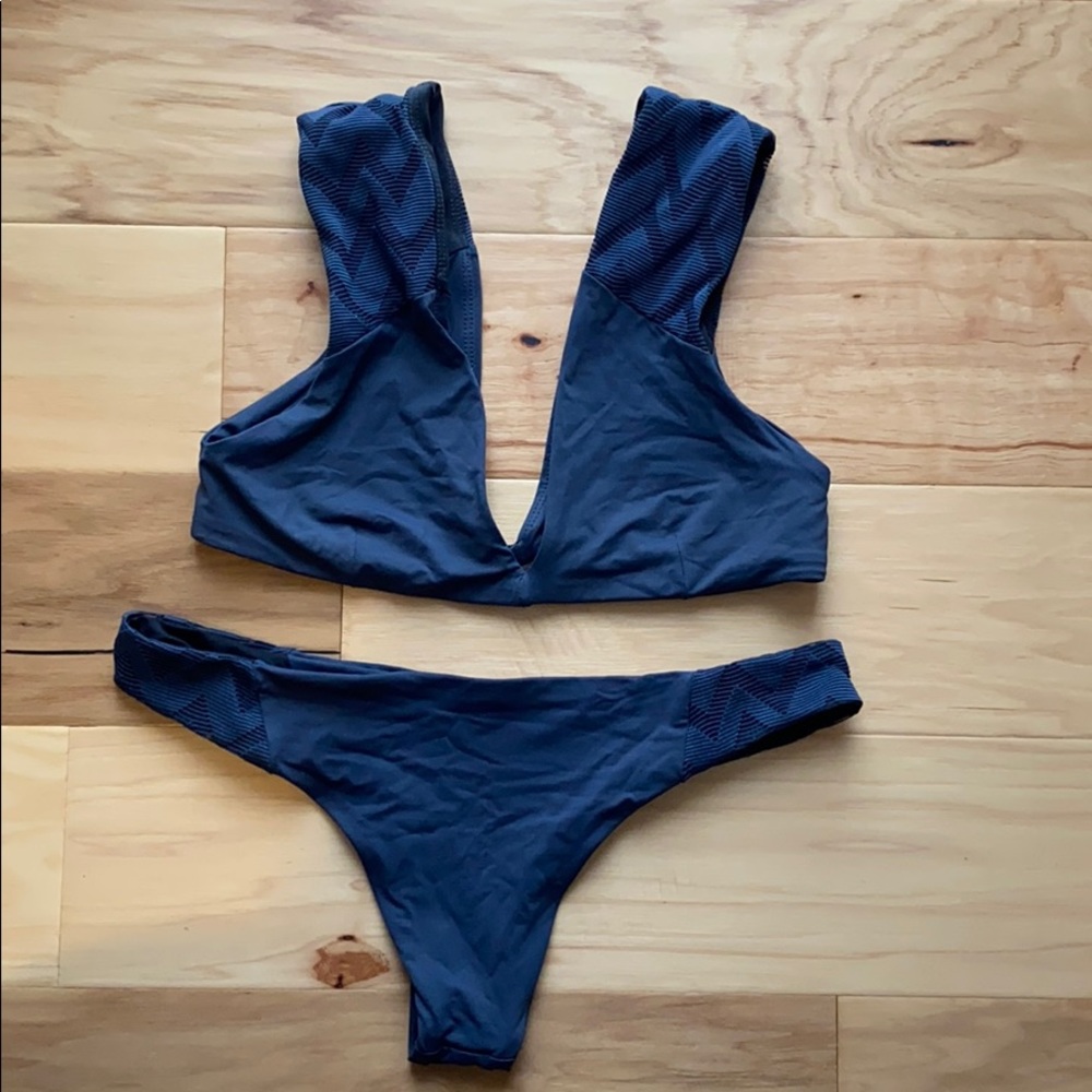 Worn once two piece swimsuit. Navy blue.